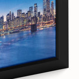 Close-up of a textured black wall art featuring a colorful Manhattan skyline on an extra large framed canvas.