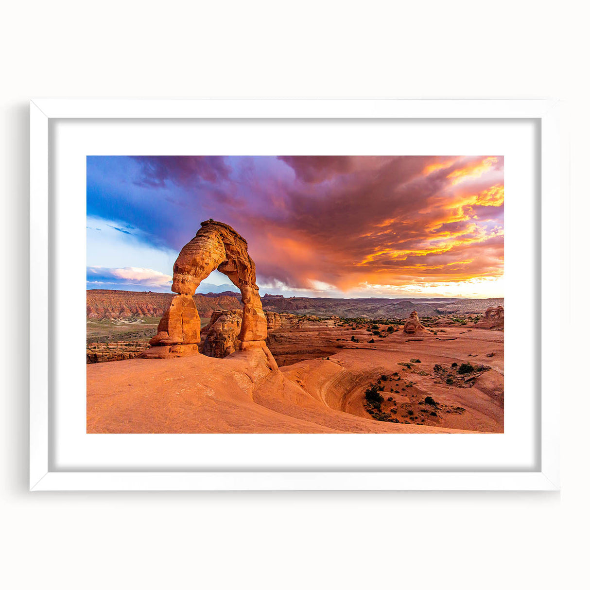 Abstract art print of Arches National Park in Utah, featuring earthy red and orange tones on a white framed canvas.