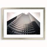 Textured art print of abstract Seattle skyline in muted gray and silver tones on a framed canvas, suitable for bedroom decor.