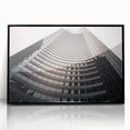 Large abstract wall art depicting Seattle skyline in muted gray and blue tones, framed in black acrylic.