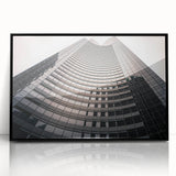 Large abstract wall art depicting Seattle skyline in muted gray and blue tones, framed in black acrylic.