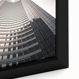 Black wall art featuring a textured, colorful depiction of the Seattle skyline on a framed canvas.