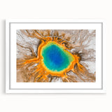 Abstract art print of Yellowstone scenery in muted earth tones on a white framed mat, ideal for dining room decor.