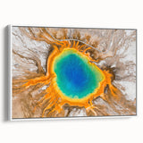 Vintage poster art of Yellowstone scenery on framed canvas, featuring colorful art with black borders.