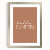 Textured abstract art print depicting autumnal colors in shades of orange and brown, framed in silver.