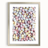 Textured art depicting abstract spring themes in soft green and yellow tones on a framed silver mat.