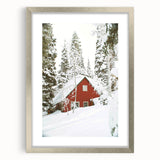 Textured abstract art print depicting winter scene in muted blue and white tones, framed in silver.