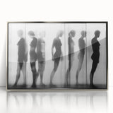 Framed abstract figurative art piece in silver acrylic, showcasing dynamic shapes and vibrant colors, perfect for modern interior decor. This contemporary artwork adds a touch of elegance and sophistication to any space.