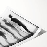 Abstract figurative art print featuring vibrant colors and dynamic shapes, rolled and ready for display, showcasing artistic expression and modern design.