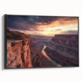 Framed canvas artwork showcasing a stunning landscape of canyons, featuring vibrant colors and intricate details, displayed in a sleek black frame, perfect for home decor.