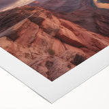 Stunning rolled canvas print showcasing a breathtaking landscape of canyons at sunset, featuring vibrant orange and purple hues, perfect for home decor.