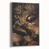 Framed canvas featuring a vintage landscape painting of autumn trees in vibrant red and orange hues.