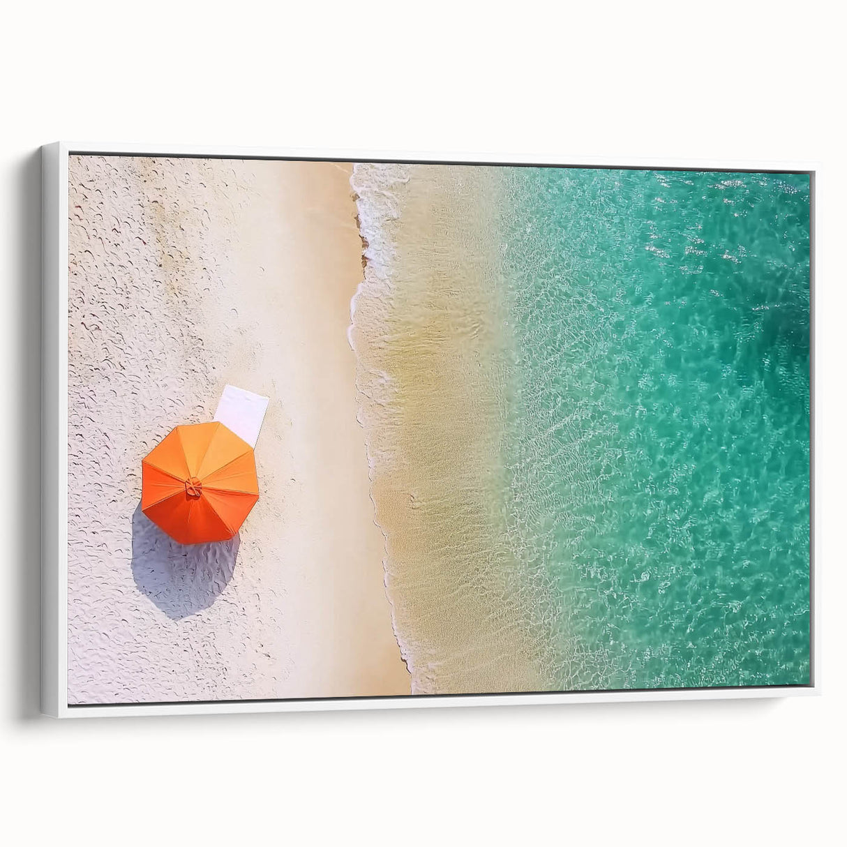 Framed canvas art showcasing a serene beach landscape with vibrant blue skies and gentle waves, presented in a sleek white frame, perfect for coastal-themed decor.