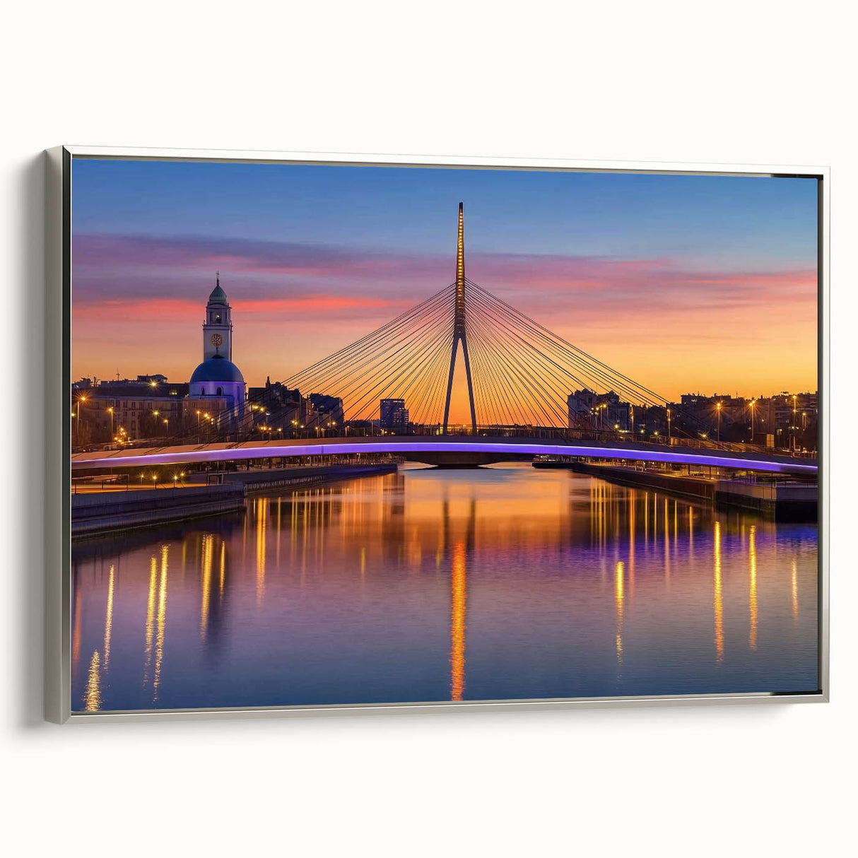 Framed landscape canvas artwork depicting a serene bridge scene with a silver frame, showcasing intricate details and vibrant colors, perfect for home decor.