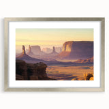 Framed landscape artwork showcasing vibrant canyons in rich colors, set in a sleek silver frame with a white mat, ideal for enhancing modern decor.