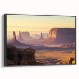 Framed landscape canvas artwork showcasing a breathtaking canyon scene, with vibrant earth tones and a sleek black frame, ideal for home decor enhancement.