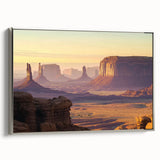 Framed canvas artwork depicting a vibrant landscape of canyons in warm earth tones, featuring a sleek silver frame that enhances the scenic view. Perfect for home decor.