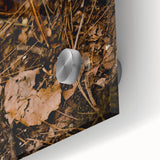 Large abstract wall art in warm autumnal hues on acrylic glass, ideal for dining room ambiance.