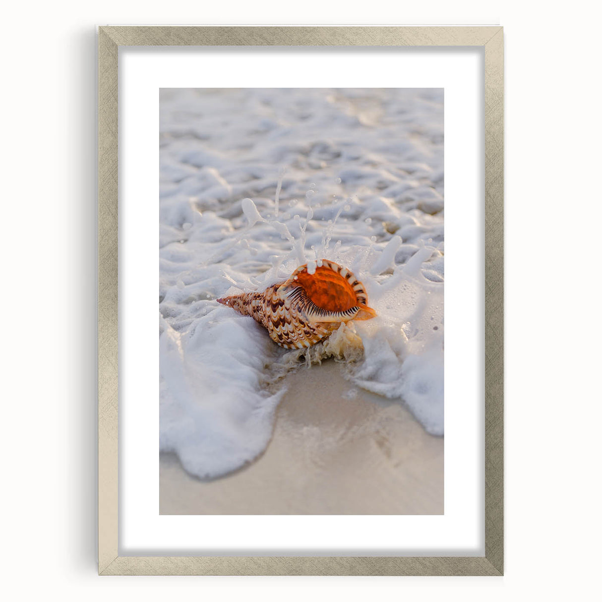 Textured abstract art print in warm orange and yellow tones on a silver-framed canvas, suitable for bedroom decor.