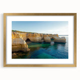 Elegant gold-framed landscape print featuring dramatic cliffs, enhancing any decor with its vibrant colors and intricate matting, perfect for nature lovers.
