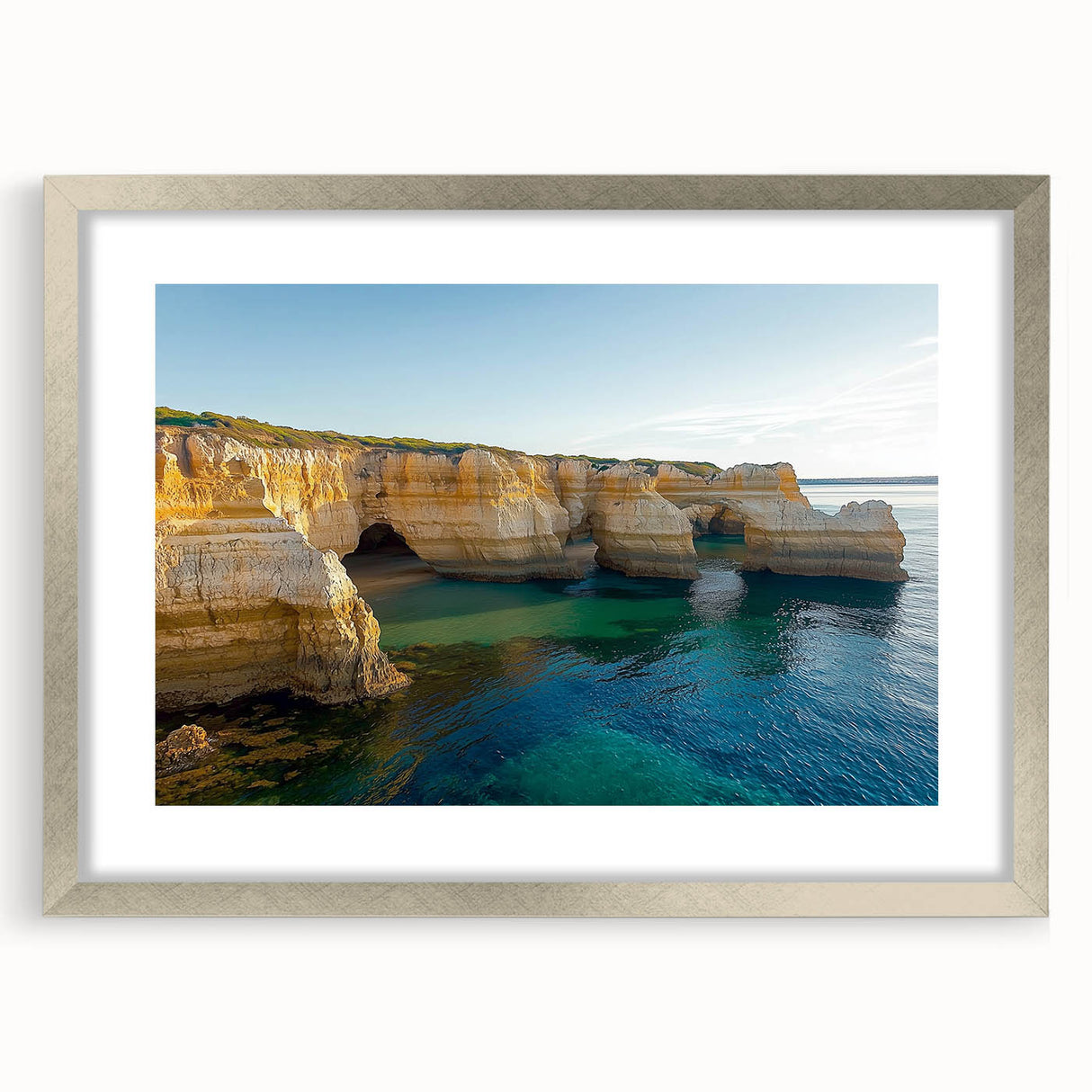 Framed landscape art print showcasing dramatic cliffs in soft hues, featuring a sleek silver matting that enhances the overall aesthetic, perfect for home decor.