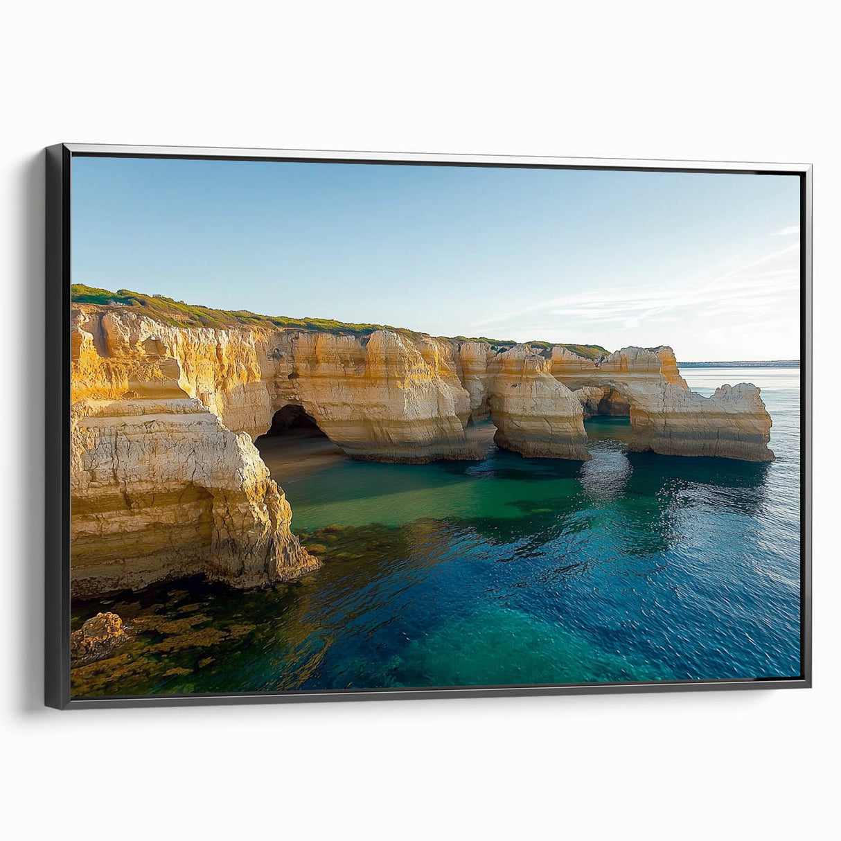 Framed canvas artwork showcasing a dramatic cliff landscape with vibrant colors, displayed in a sleek black frame, perfect for home decor.