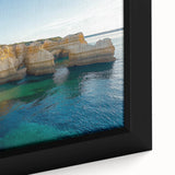 Close-up of a framed canvas artwork showcasing a vibrant landscape with dramatic cliffs and lush greenery, ideal for home decor or gallery display.