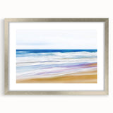 Silver-framed landscape artwork depicting serene beaches, featuring a white mat for enhanced presentation, ideal for home or office decor.