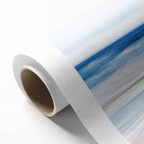 Rolled canvas showcasing a vibrant beach landscape design with waves and palm trees, packaged securely in a protective cardboard tube for easy shipping.