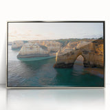 Framed acrylic landscape artwork showcasing dramatic cliffs and serene ocean waves, highlighted by a silver frame, ideal for modern home decor.