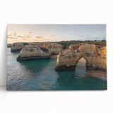 Stretched canvas artwork depicting a serene landscape of cliffs with a sunset backdrop, showcasing vibrant colors and intricate details, perfect for home decor.