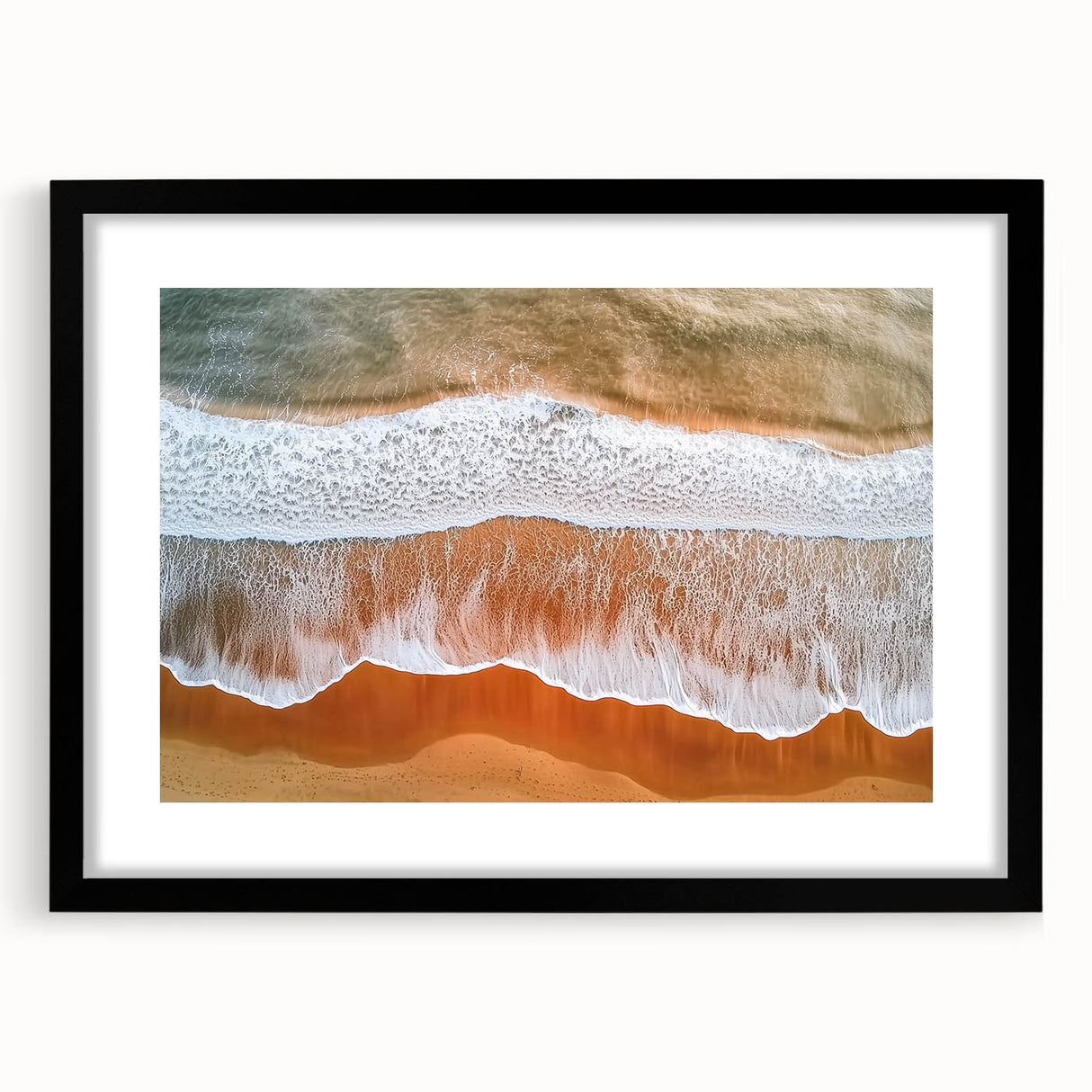 Black-framed landscape artwork depicting serene beaches with soft waves and golden sand, featuring a white mat for an elegant presentation, ideal for coastal decor.