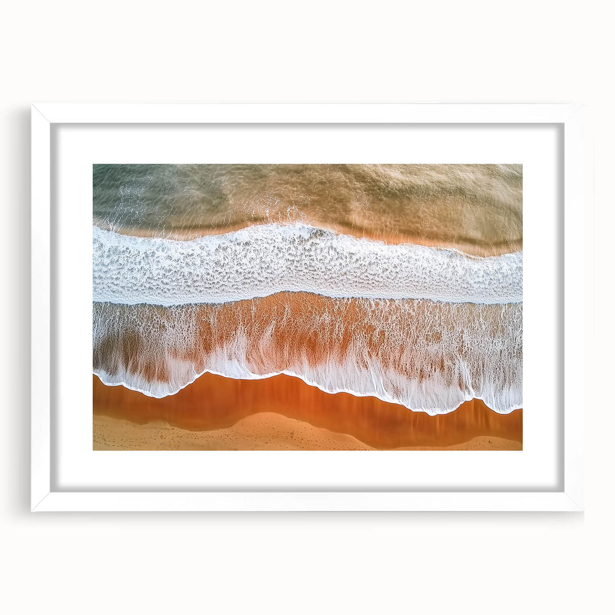 Landscape print of a serene beach scene framed in white with a mat, showcasing soft pastel colors and tranquil waves, ideal for coastal decor enthusiasts.