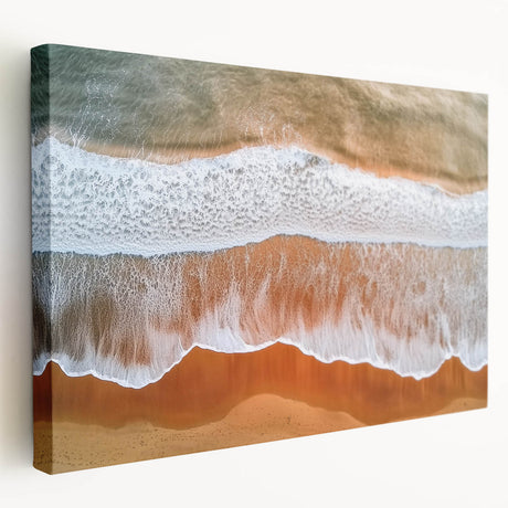 Stretched canvas artwork depicting a serene beach landscape, showcasing vibrant colors of blue water and golden sand, ideal for coastal home decor.