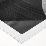 Rolled canvas showcasing a vibrant landscape bridge design with rich colors and intricate details, securely packaged in a protective cardboard tube for safe shipping.