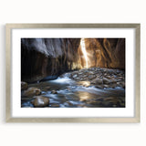 Landscape artwork of a canyon scene framed in a sleek silver frame with a white mat, showcasing rich earthy tones and intricate details that enhance any decor.