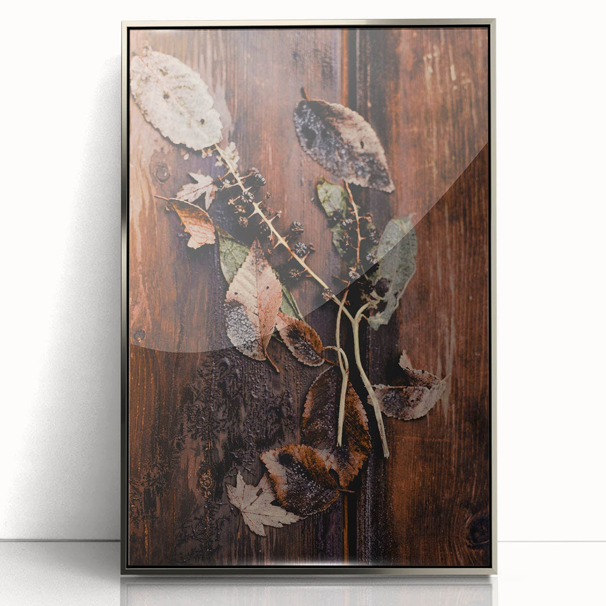 Mid-century modernist art depicting autumn trees in orange and yellow tones, framed in silver acrylic.