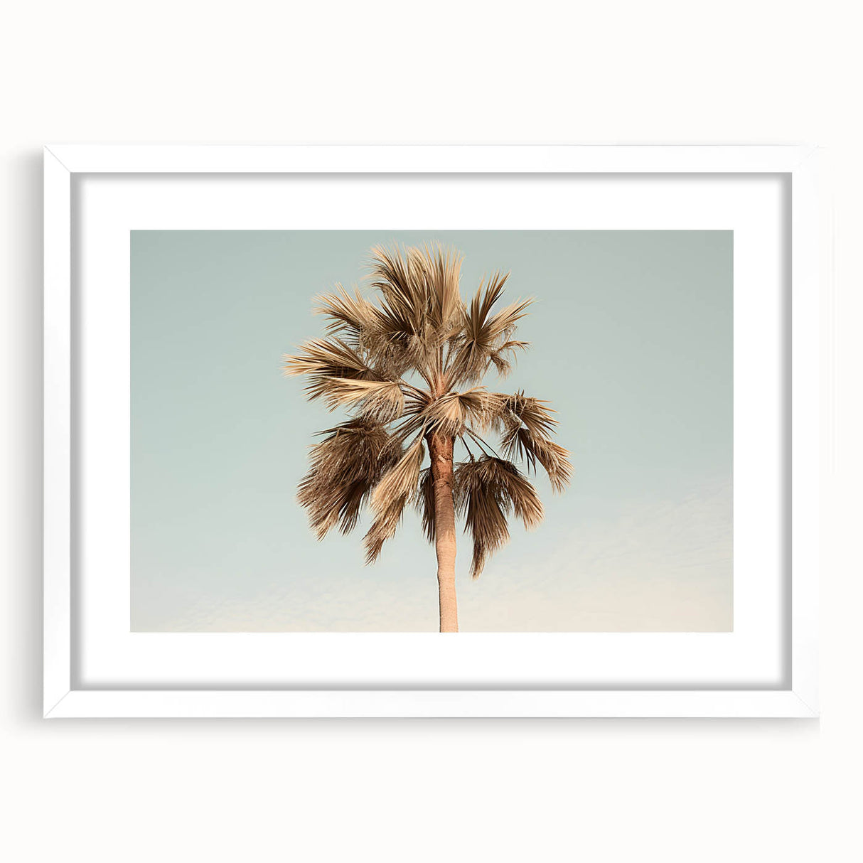 Abstract art print featuring swirls of blue and white, displayed in a white frame.