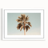 Abstract art print featuring swirls of blue and white, displayed in a white frame.