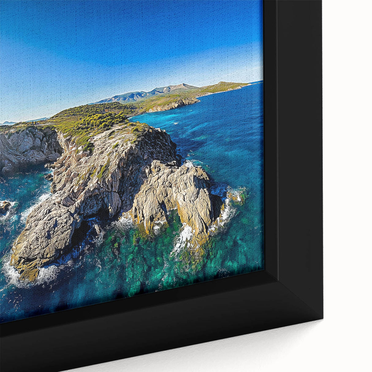 Close-up of a framed canvas depicting dramatic cliffs against a vibrant sunset, showcasing rich colors and intricate details ideal for modern home decor.