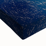 Close-up of a stretched canvas artwork depicting dramatic cliffs and vibrant landscapes, showcasing intricate textures and rich colors, perfect for home decor.