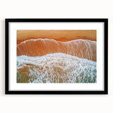 Black framed landscape art print featuring serene beach scene with gentle waves and soft clouds. Ideal for coastal home decor, enhancing tranquil ambiance.