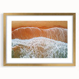 Landscape artwork featuring a serene beach scene framed with a gold mat, highlighting vibrant colors and tranquil ocean waves, perfect for home decor.