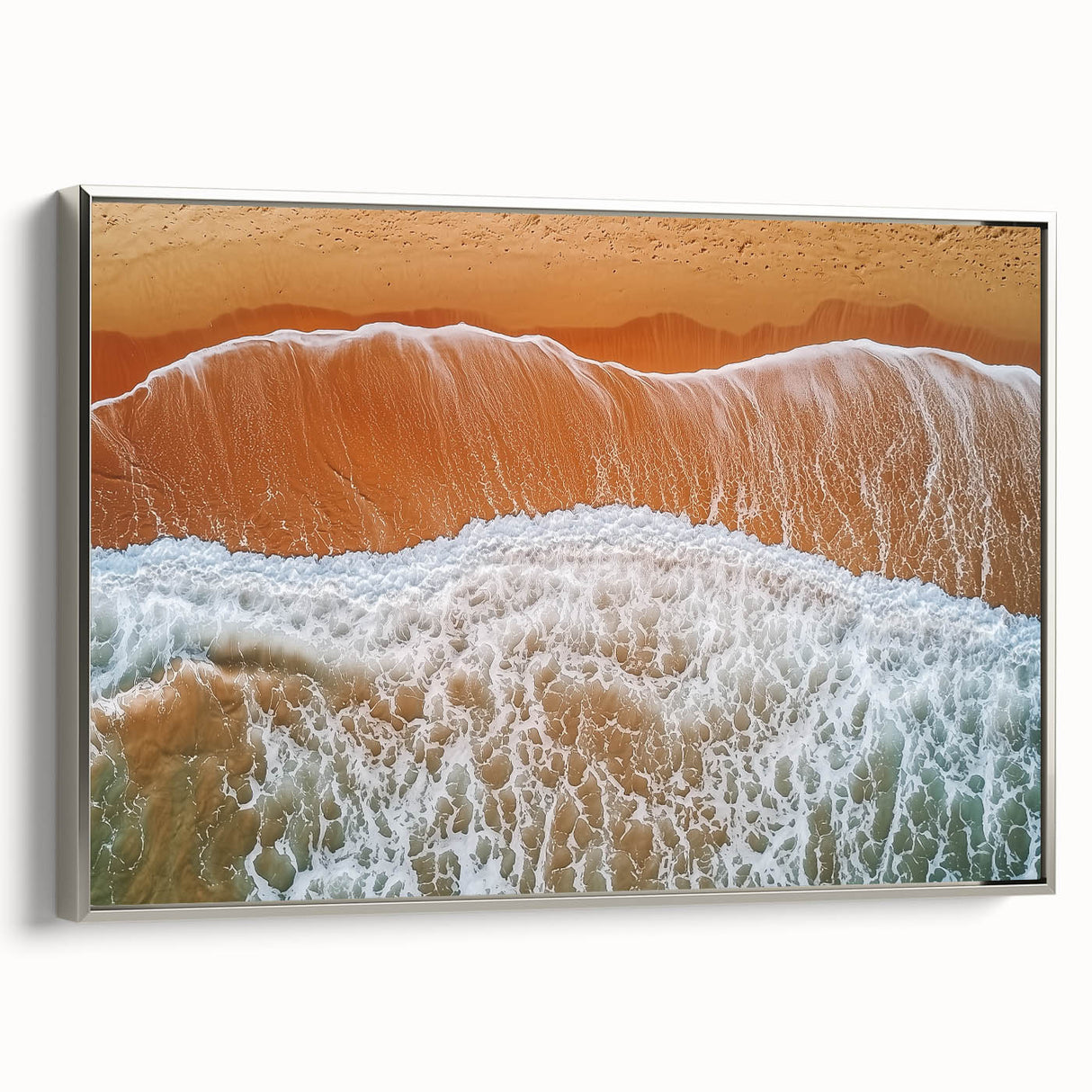 Framed canvas artwork depicting a serene beach landscape with vibrant colors and silver frame, showcasing tranquil ocean waves and a clear sky, ideal for home decor.