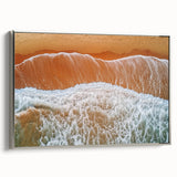 Framed canvas artwork depicting a serene beach landscape with vibrant colors and silver frame, showcasing tranquil ocean waves and a clear sky, ideal for home decor.