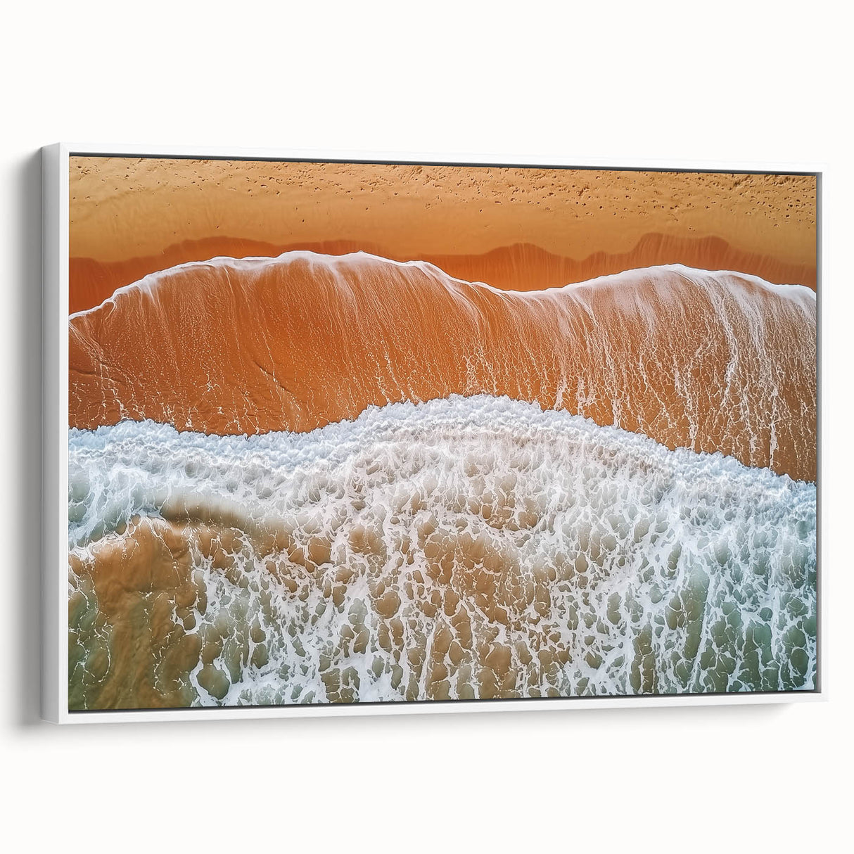 Framed canvas art depicting a serene beach landscape, showcasing vibrant colors and gentle waves, with a sleek white frame enhancing its coastal charm.