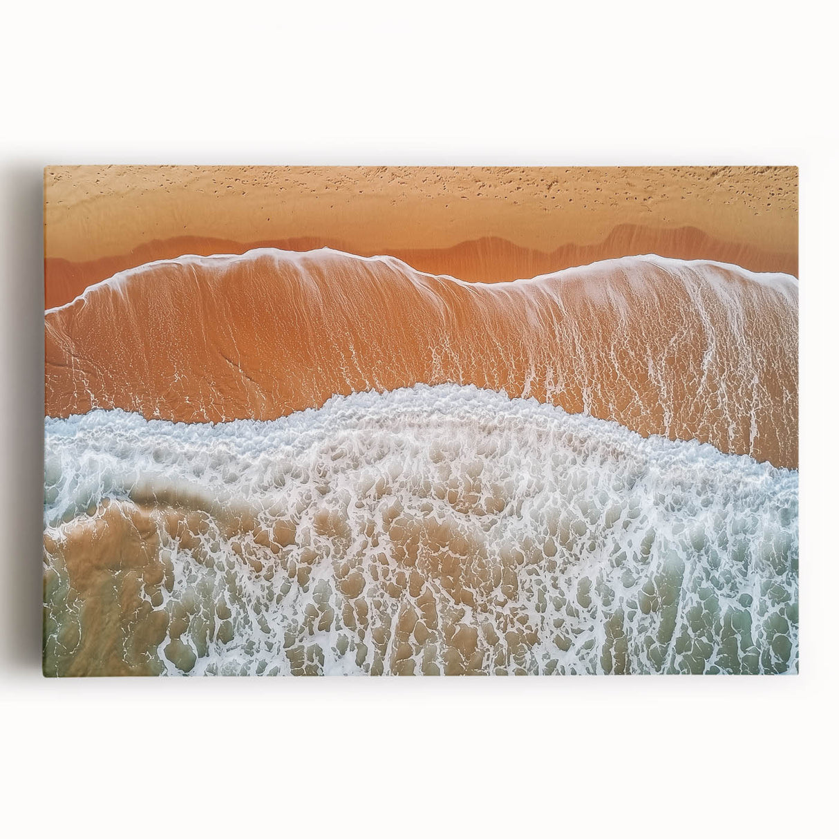 Vibrant stretched canvas artwork depicting a serene beach landscape at sunset, showcasing soft pastel colors and gentle waves, perfect for coastal home decor.