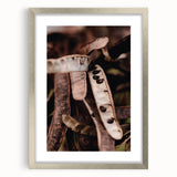 Textured abstract art print depicting autumnal hues in a silver frame, ideal for bedroom wall decor.