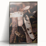 Mid-century modernist art depicting an abstract fall scene in warm orange and brown tones, framed in silver acrylic.