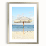 Textured abstract art print in vibrant orange and yellow tones on a silver-framed canvas, suitable for bedroom art.